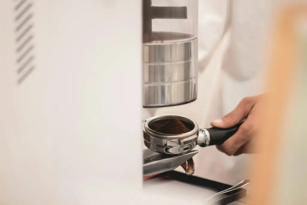 Portafilter held under an electric grinder's chute