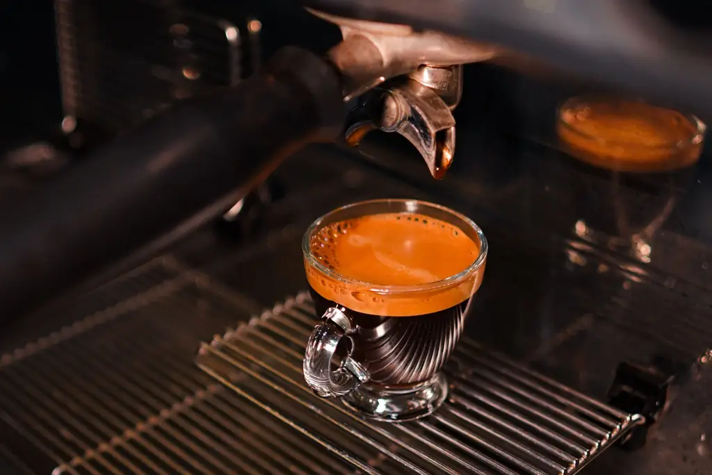 Espresso shot pouring from a café machine